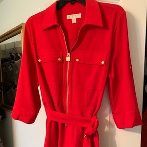 - Michael Kors vibrant red dress with gold accents